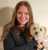 Abbigail Holding Small Dog