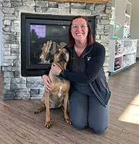 Shaina With Dog By Fireplace